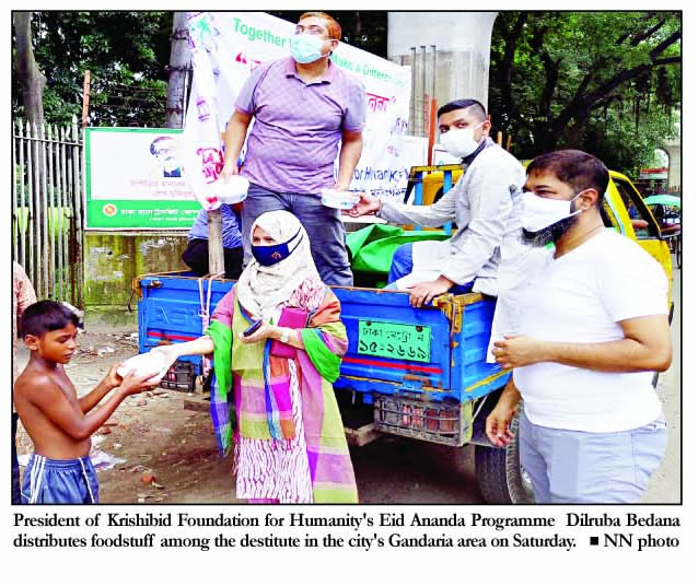 President of Krishibid Foundation for Humanity's Eid Ananda Programme Dilruba Bedana distributes foodstuff among the destitute in the city's Gandaria area on day after Eid-ul-Azah.